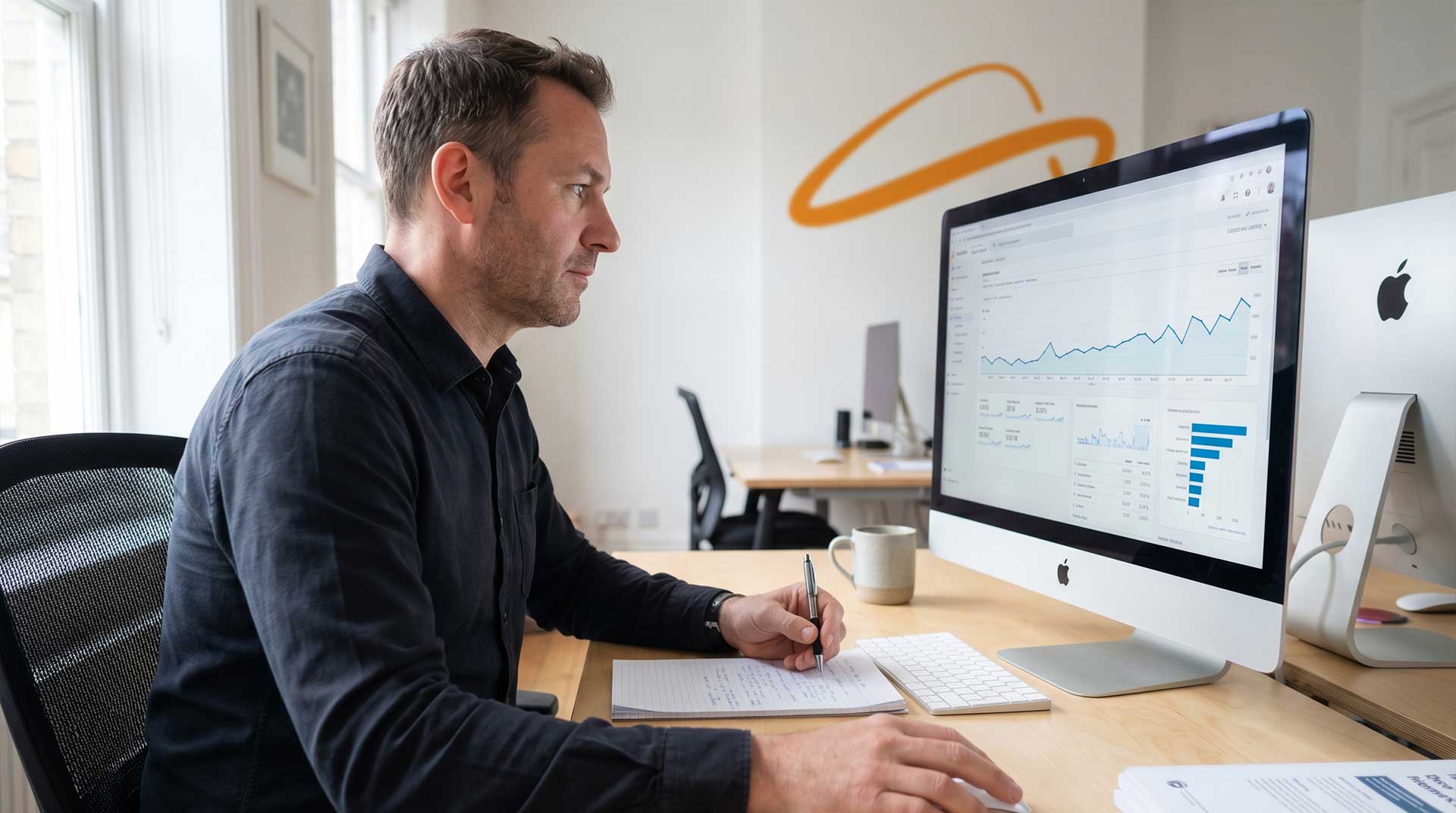 Digital marketing specialist reviewing Google Analytics data at Buzz Design in West Yorkshire